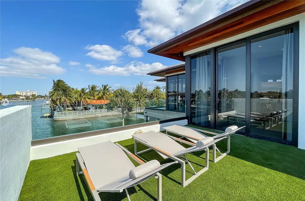The Waterfront Home is a fully furnished smart residence with nice water views now available for sale. This home located at 2213 Keystone Blvd, North Miami, Florida; offering 5 bedrooms and 6 bathrooms with over 6,200 square feet of living spaces.
