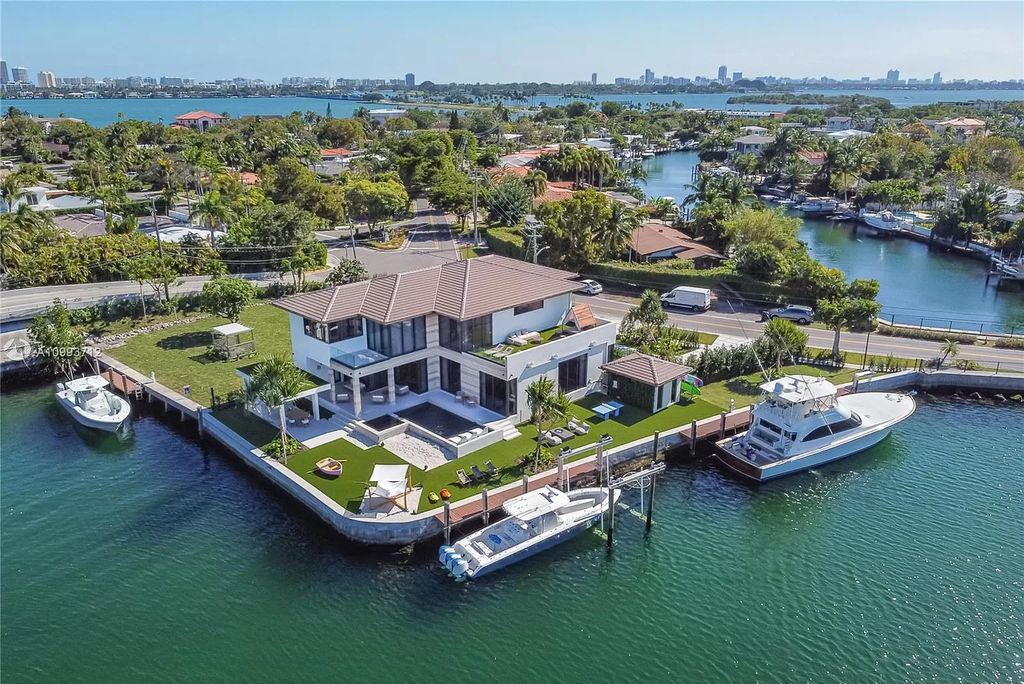The Waterfront Home is a fully furnished smart residence with nice water views now available for sale. This home located at 2213 Keystone Blvd, North Miami, Florida; offering 5 bedrooms and 6 bathrooms with over 6,200 square feet of living spaces.