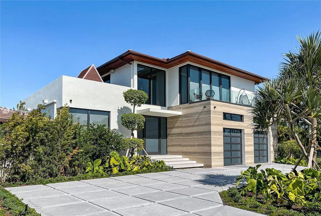 The Waterfront Home is a fully furnished smart residence with nice water views now available for sale. This home located at 2213 Keystone Blvd, North Miami, Florida; offering 5 bedrooms and 6 bathrooms with over 6,200 square feet of living spaces.