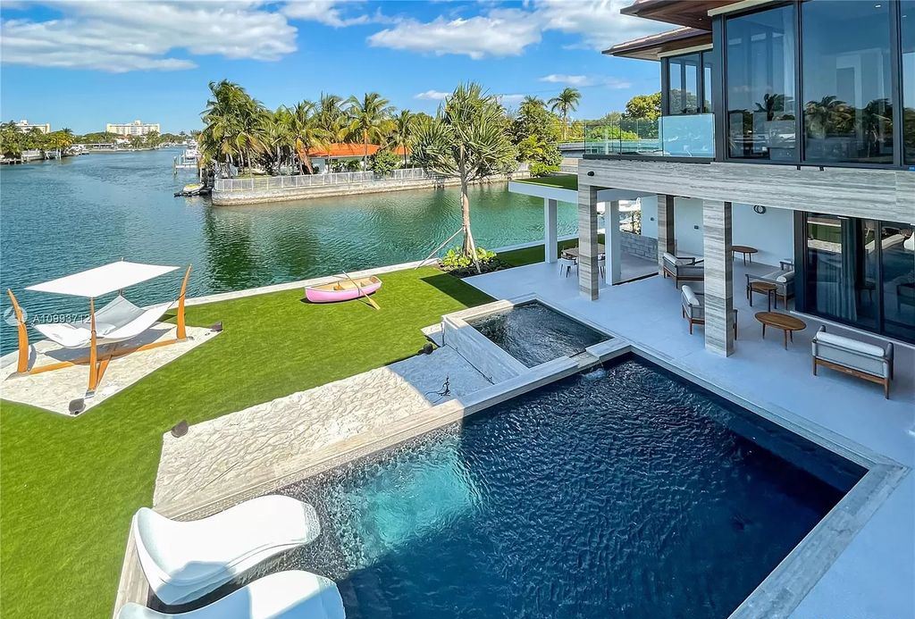The Waterfront Home is a fully furnished smart residence with nice water views now available for sale. This home located at 2213 Keystone Blvd, North Miami, Florida; offering 5 bedrooms and 6 bathrooms with over 6,200 square feet of living spaces.