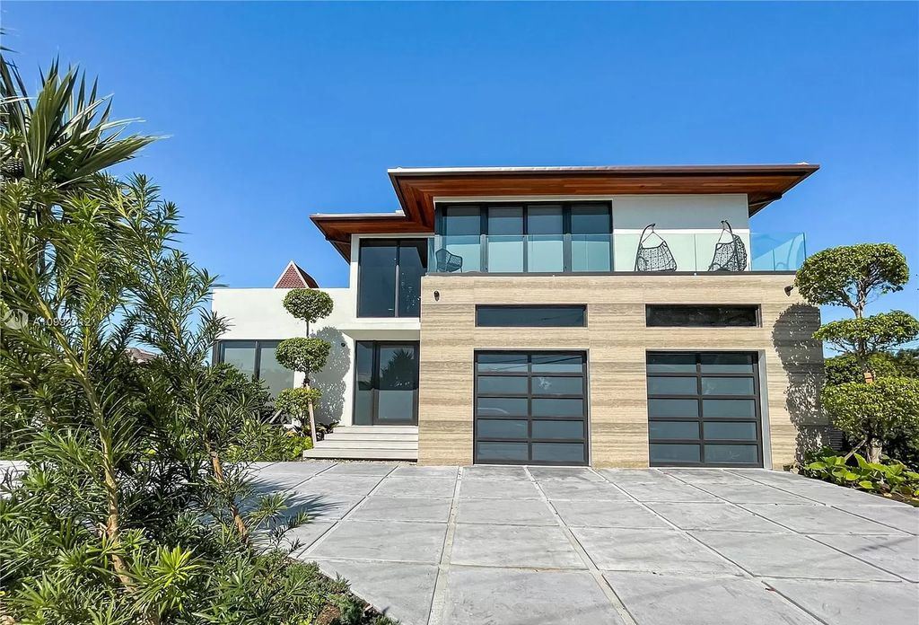 The Waterfront Home is a fully furnished smart residence with nice water views now available for sale. This home located at 2213 Keystone Blvd, North Miami, Florida; offering 5 bedrooms and 6 bathrooms with over 6,200 square feet of living spaces.
