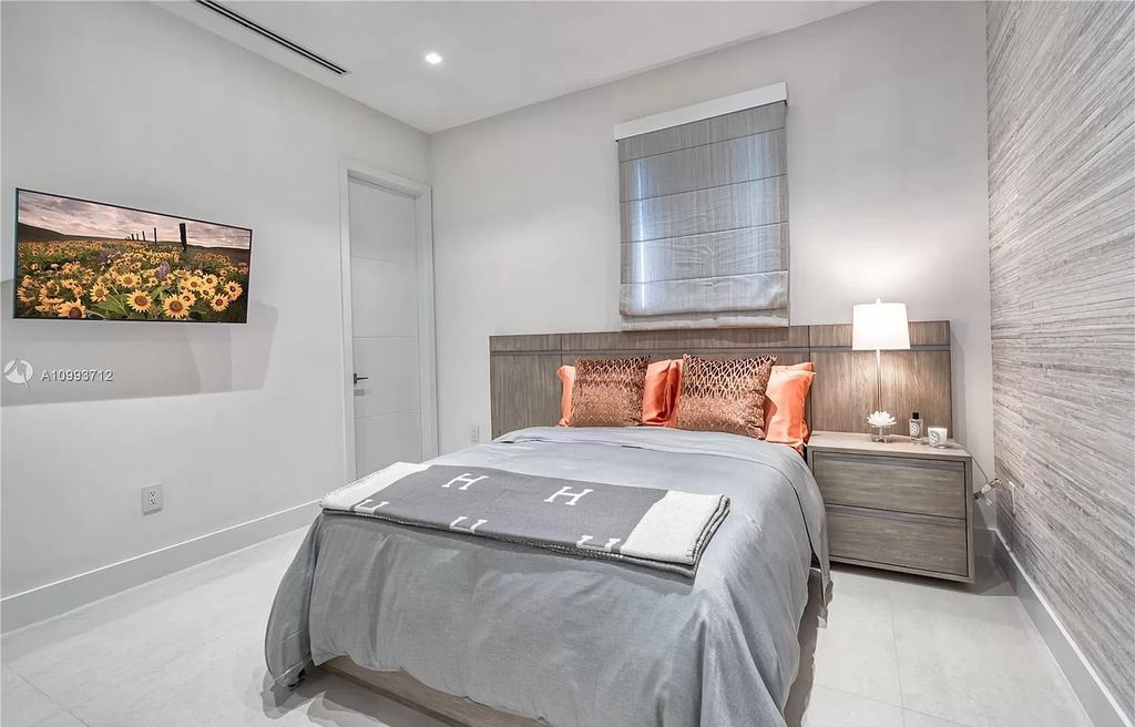The Waterfront Home is a fully furnished smart residence with nice water views now available for sale. This home located at 2213 Keystone Blvd, North Miami, Florida; offering 5 bedrooms and 6 bathrooms with over 6,200 square feet of living spaces.