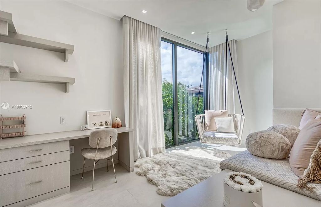 The Waterfront Home is a fully furnished smart residence with nice water views now available for sale. This home located at 2213 Keystone Blvd, North Miami, Florida; offering 5 bedrooms and 6 bathrooms with over 6,200 square feet of living spaces.