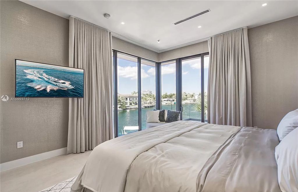 The Waterfront Home is a fully furnished smart residence with nice water views now available for sale. This home located at 2213 Keystone Blvd, North Miami, Florida; offering 5 bedrooms and 6 bathrooms with over 6,200 square feet of living spaces.