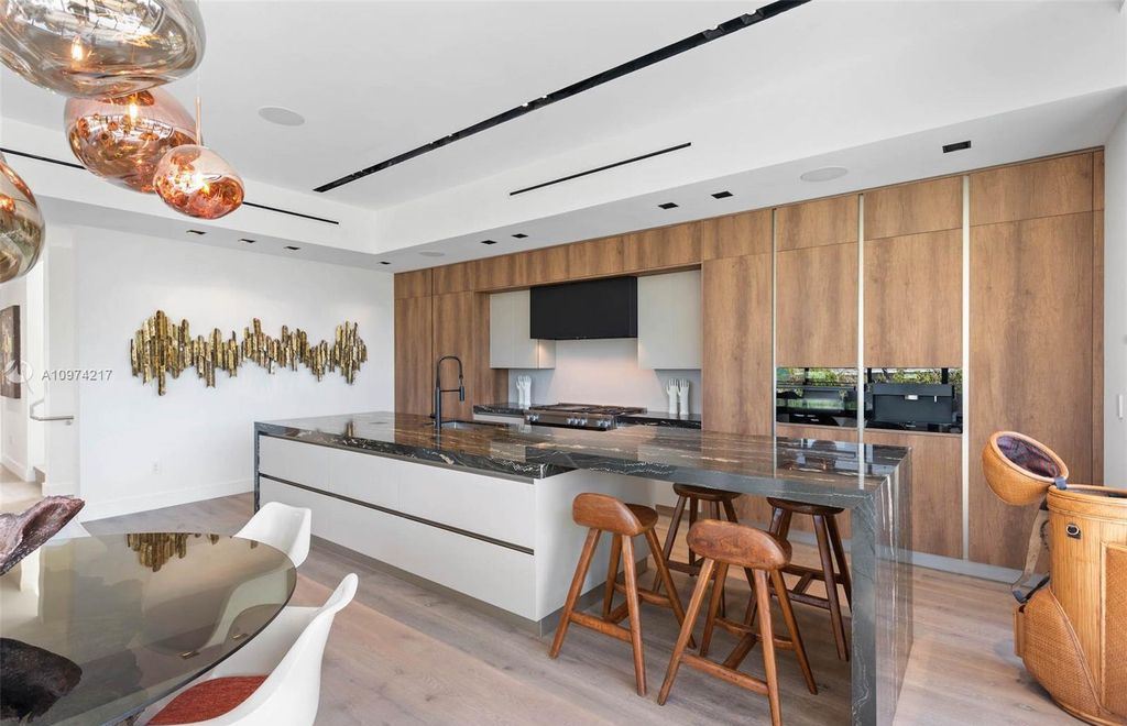The Modern House in Miami Beach is a newly built tropical residence offering expansive western views of the La Gorce Country Club Golf Course now available for sale. This home located at 5470 La Gorce Dr, Miami Beach, Florida; offering 4 bedrooms and 4 bathrooms with over 3,600 square feet of living spaces.