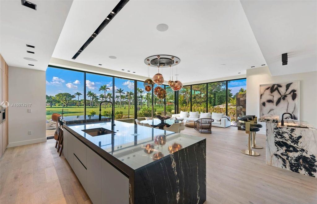 The Modern House in Miami Beach is a newly built tropical residence offering expansive western views of the La Gorce Country Club Golf Course now available for sale. This home located at 5470 La Gorce Dr, Miami Beach, Florida; offering 4 bedrooms and 4 bathrooms with over 3,600 square feet of living spaces.