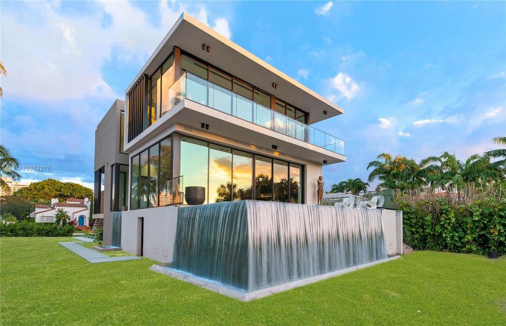 The Modern House in Miami Beach is a newly built tropical residence offering expansive western views of the La Gorce Country Club Golf Course now available for sale. This home located at 5470 La Gorce Dr, Miami Beach, Florida; offering 4 bedrooms and 4 bathrooms with over 3,600 square feet of living spaces.