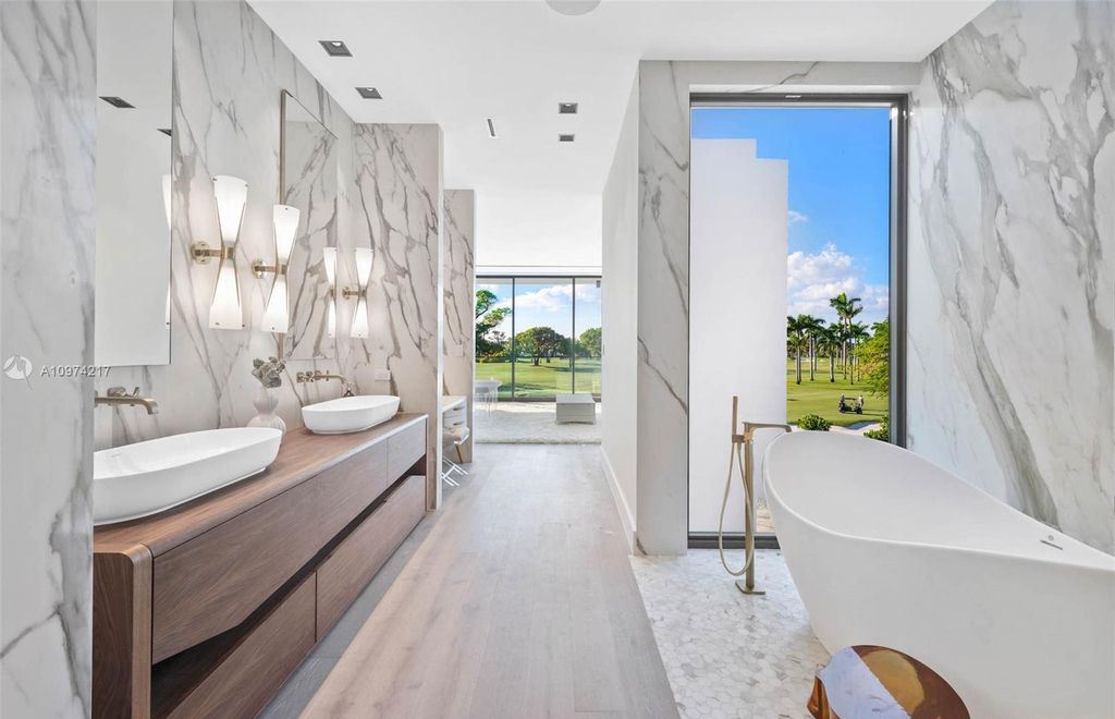 The Modern House in Miami Beach is a newly built tropical residence offering expansive western views of the La Gorce Country Club Golf Course now available for sale. This home located at 5470 La Gorce Dr, Miami Beach, Florida; offering 4 bedrooms and 4 bathrooms with over 3,600 square feet of living spaces.