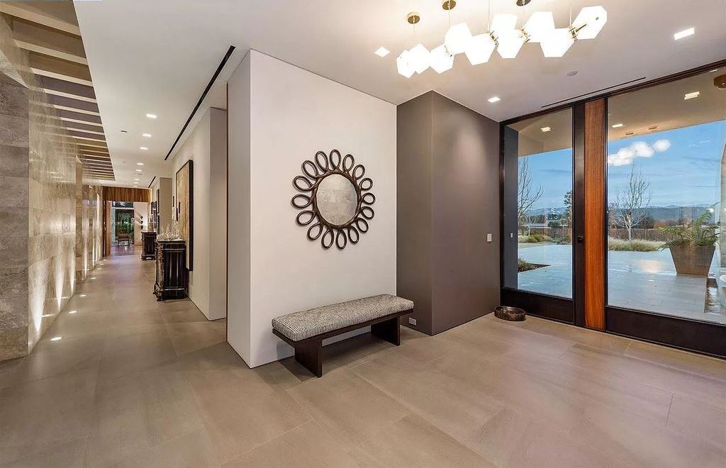 The Estate in California is an extraordinary Napa Valley property features wellness pavilion, sport court, infinity pool now available for sale. This home located at 1561 S Whitehall Ln, Saint Helena, California; offering 7 bedrooms and 11 bathrooms with over 14,000 square feet of living spaces.