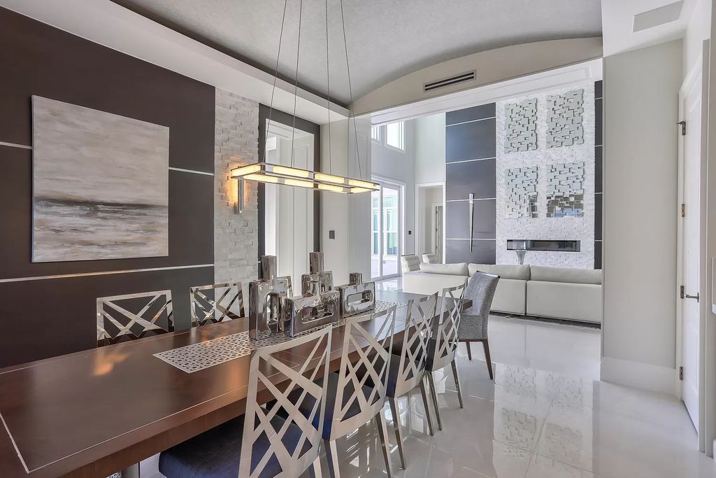The West Palm Beach House is a luxurious dream home to experience true luxury lifestyle with impressive finishes now available for sale. This home located at 14100 N Miller Dr, West Palm Beach, Florida; offering 5 bedrooms and 8 bathrooms with over 5,100 square feet of living spaces.
