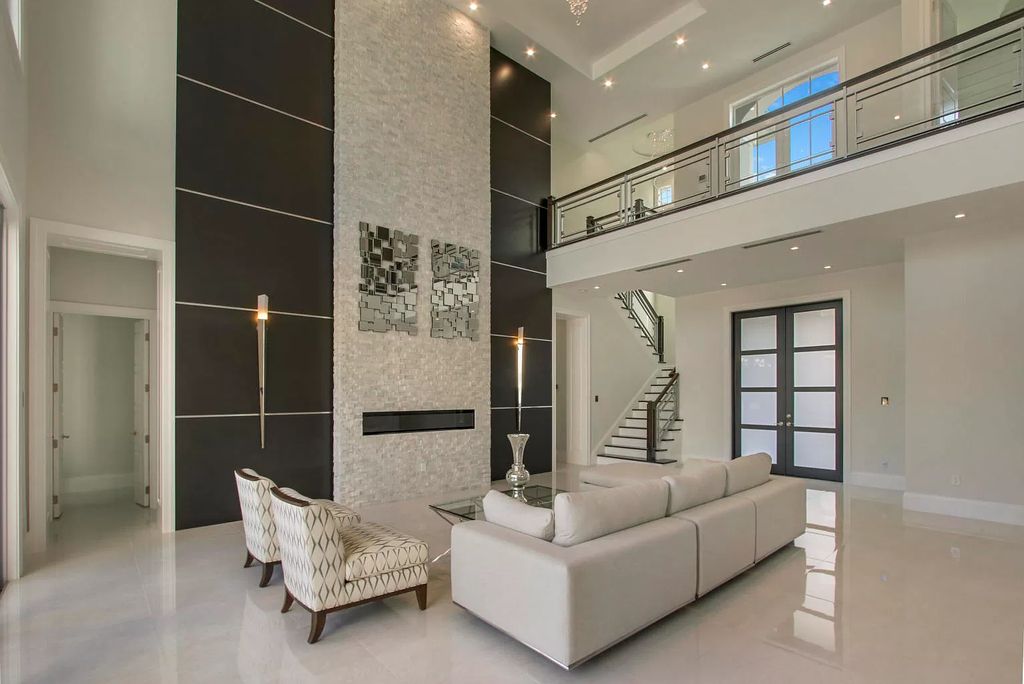 The West Palm Beach House is a luxurious dream home to experience true luxury lifestyle with impressive finishes now available for sale. This home located at 14100 N Miller Dr, West Palm Beach, Florida; offering 5 bedrooms and 8 bathrooms with over 5,100 square feet of living spaces.