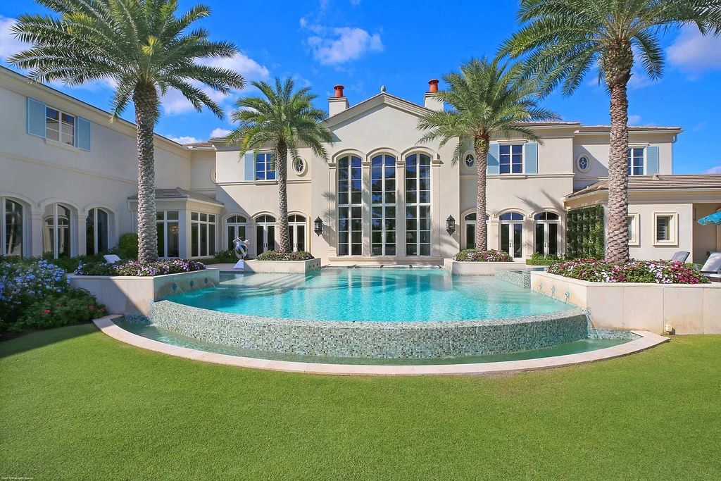 The Custom Home in Florida is a luxurious estate situated on the finest lot in prestigious Old Palm now available for sale. This home located at 11748 Bella Donna Ct, Palm Beach Gardens, Florida; offering 6 bedrooms and 9 bathrooms with over 10,000 square feet of living spaces.