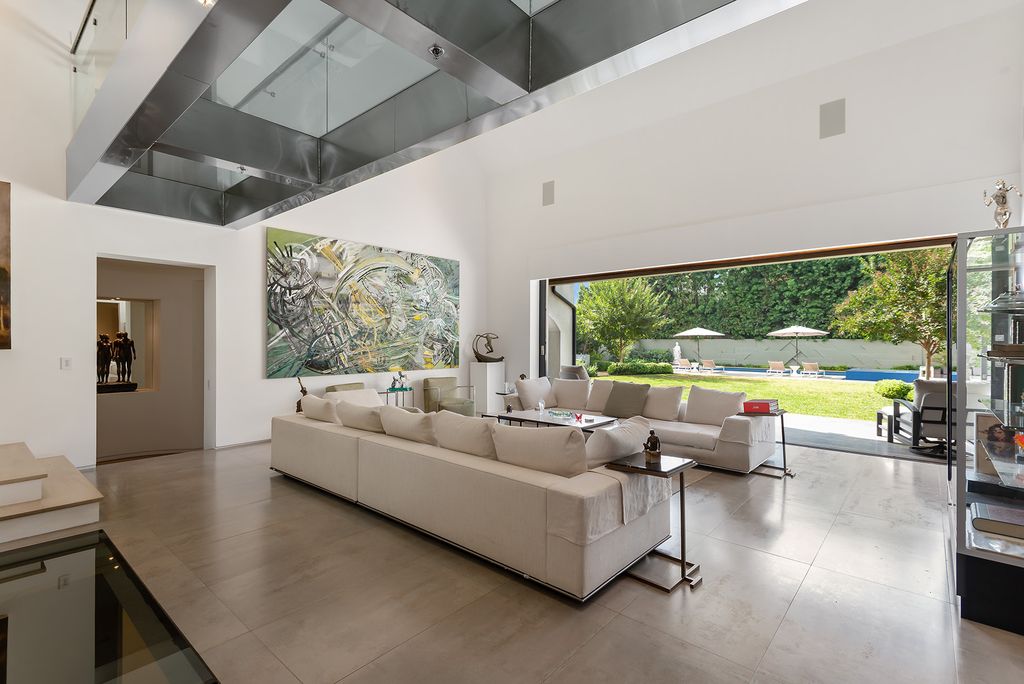 The Home in Los Angeles is an absolutely breathtaking property perfects for outdoor entertaining with the cozy loggia & fireplace now available for sale. This home located at 383 S Beverly Glen Blvd, Los Angeles, California; offering 6 bedrooms and 8 bathrooms with over 7,000 square feet of living spaces.