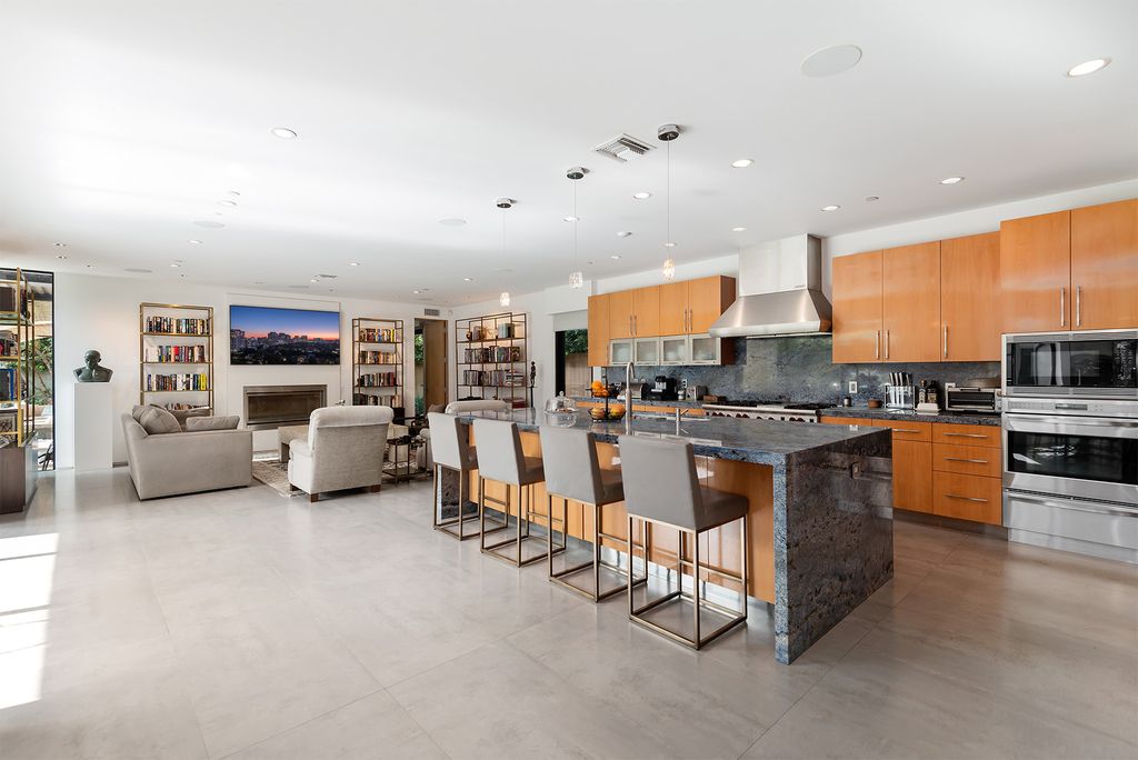 The Home in Los Angeles is an absolutely breathtaking property perfects for outdoor entertaining with the cozy loggia & fireplace now available for sale. This home located at 383 S Beverly Glen Blvd, Los Angeles, California; offering 6 bedrooms and 8 bathrooms with over 7,000 square feet of living spaces.