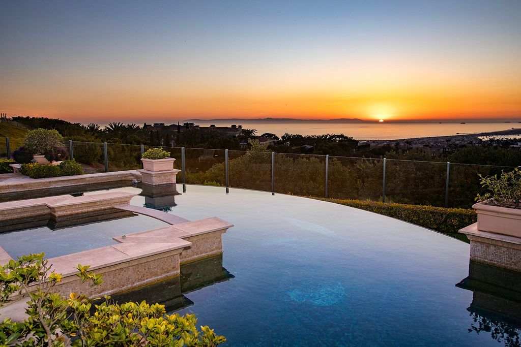 The Newport Coast Home boasts coastal southern California grandeur throughout on a front row unobstructed hilltop now available for sale. This home located at 7 Sailcrest, Newport Coast, California; offering 7 bedrooms and 8 bathrooms with over 9,800 square feet of living spaces.