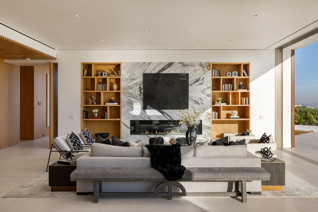 The Hollywood Hills Mansion is an amenity-rich entertainer’s paradise within walking distance to the iconic Sunset Strip now available for sale. This home located at 1422 Devlin Dr, Los Angeles, California; offering 6 bedrooms and 10 bathrooms with over 10,000 square feet of living spaces.
