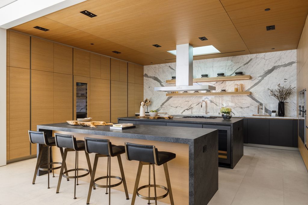 The Hollywood Hills Mansion is an amenity-rich entertainer’s paradise within walking distance to the iconic Sunset Strip now available for sale. This home located at 1422 Devlin Dr, Los Angeles, California; offering 6 bedrooms and 10 bathrooms with over 10,000 square feet of living spaces.