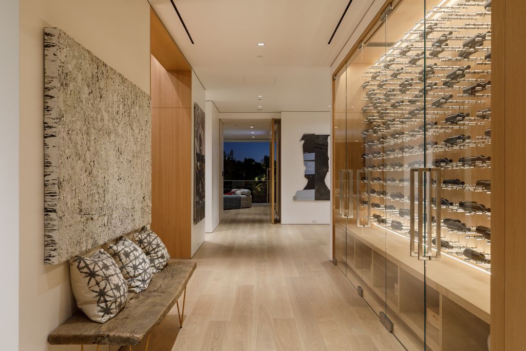 The Hollywood Hills Mansion is an amenity-rich entertainer’s paradise within walking distance to the iconic Sunset Strip now available for sale. This home located at 1422 Devlin Dr, Los Angeles, California; offering 6 bedrooms and 10 bathrooms with over 10,000 square feet of living spaces.