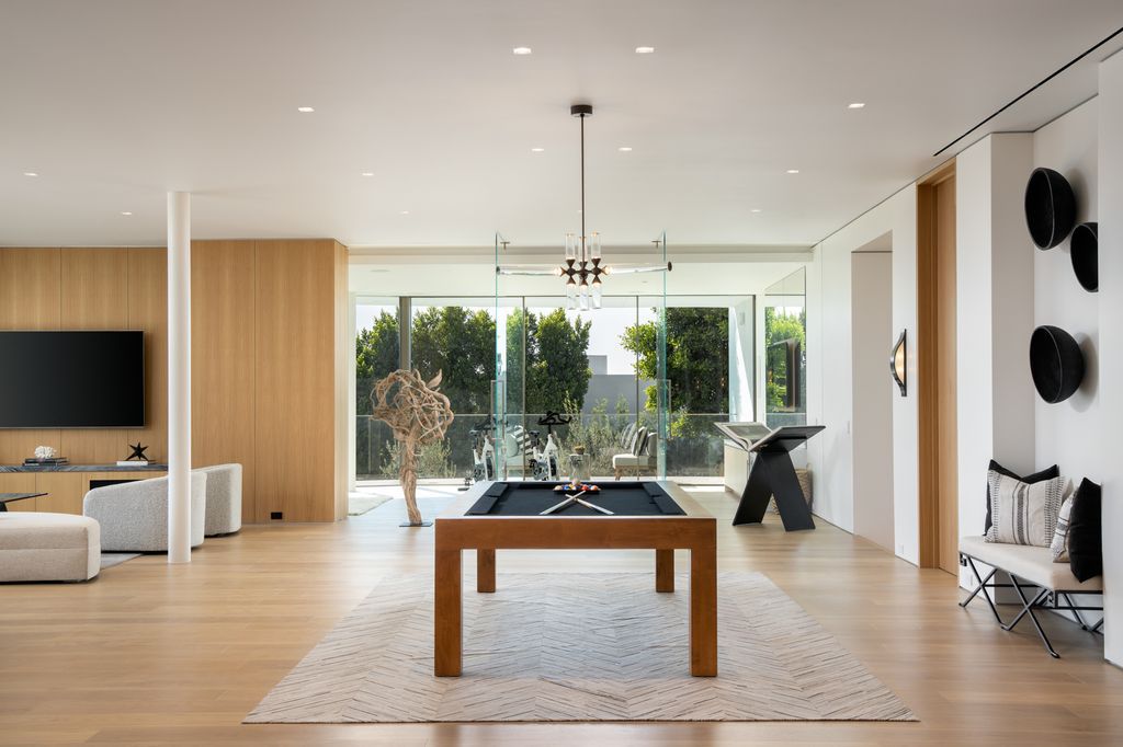 The Hollywood Hills Mansion is an amenity-rich entertainer’s paradise within walking distance to the iconic Sunset Strip now available for sale. This home located at 1422 Devlin Dr, Los Angeles, California; offering 6 bedrooms and 10 bathrooms with over 10,000 square feet of living spaces.