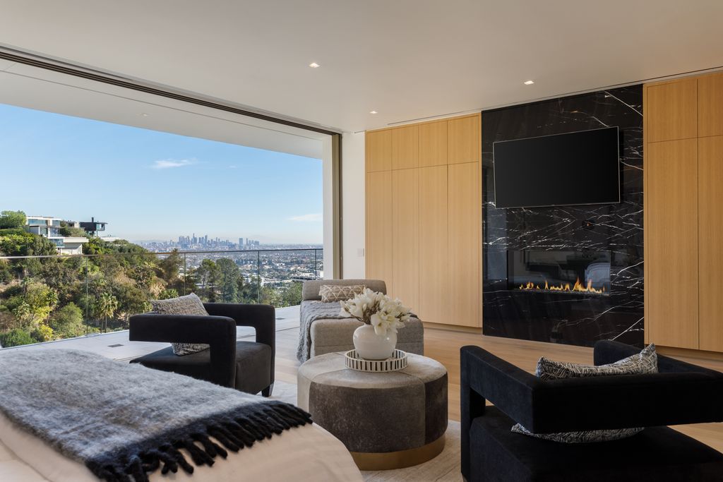 The Hollywood Hills Mansion is an amenity-rich entertainer’s paradise within walking distance to the iconic Sunset Strip now available for sale. This home located at 1422 Devlin Dr, Los Angeles, California; offering 6 bedrooms and 10 bathrooms with over 10,000 square feet of living spaces.