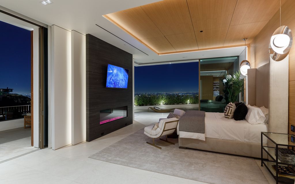 The Hollywood Hills Mansion is an amenity-rich entertainer’s paradise within walking distance to the iconic Sunset Strip now available for sale. This home located at 1422 Devlin Dr, Los Angeles, California; offering 6 bedrooms and 10 bathrooms with over 10,000 square feet of living spaces.