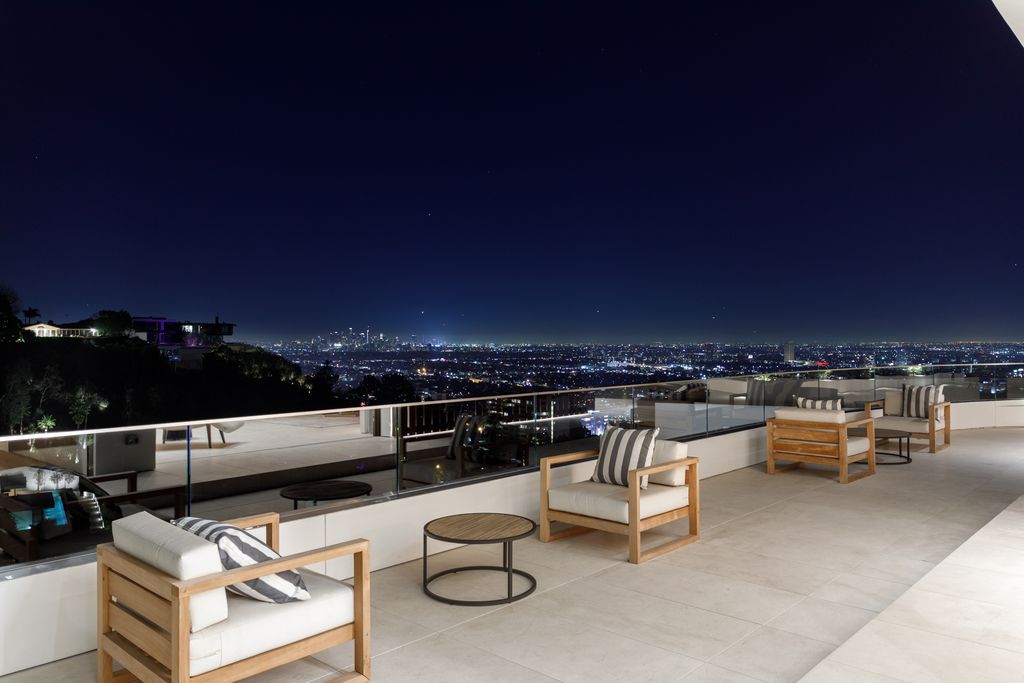 The Hollywood Hills Mansion is an amenity-rich entertainer’s paradise within walking distance to the iconic Sunset Strip now available for sale. This home located at 1422 Devlin Dr, Los Angeles, California; offering 6 bedrooms and 10 bathrooms with over 10,000 square feet of living spaces.