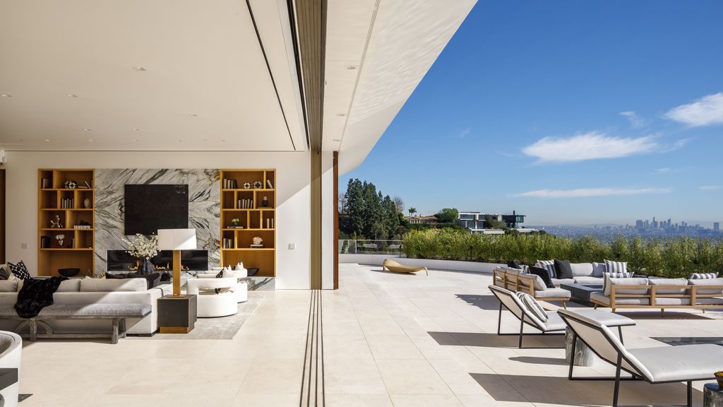 The Hollywood Hills Mansion is an amenity-rich entertainer’s paradise within walking distance to the iconic Sunset Strip now available for sale. This home located at 1422 Devlin Dr, Los Angeles, California; offering 6 bedrooms and 10 bathrooms with over 10,000 square feet of living spaces.