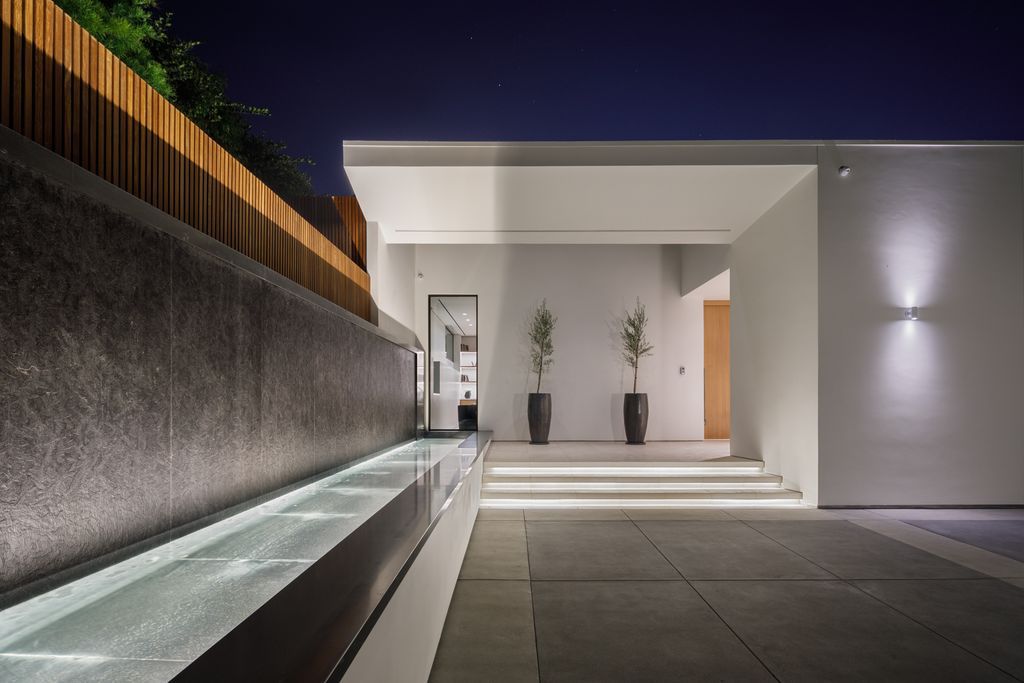 The Hollywood Hills Mansion is an amenity-rich entertainer’s paradise within walking distance to the iconic Sunset Strip now available for sale. This home located at 1422 Devlin Dr, Los Angeles, California; offering 6 bedrooms and 10 bathrooms with over 10,000 square feet of living spaces.