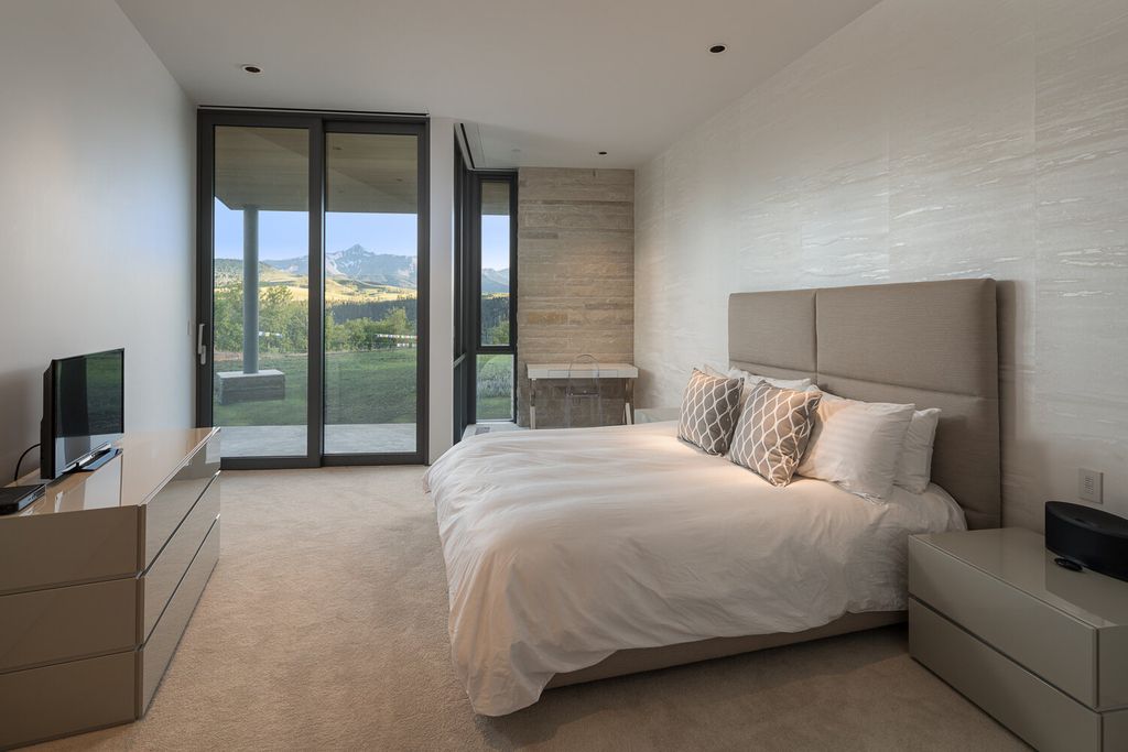 The Colorado Mansion is a modern architectural masterpiece is perched on a point featuring thrilling views of Telluride's most dramatic peaks now available for sale. This home located at 296 Gray Head Ln, Telluride, Colorado; offering 6 bedrooms and 10 bathrooms with over 11,800 square feet of living spaces.