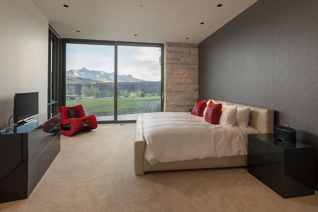 The Colorado Mansion is a modern architectural masterpiece is perched on a point featuring thrilling views of Telluride's most dramatic peaks now available for sale. This home located at 296 Gray Head Ln, Telluride, Colorado; offering 6 bedrooms and 10 bathrooms with over 11,800 square feet of living spaces.