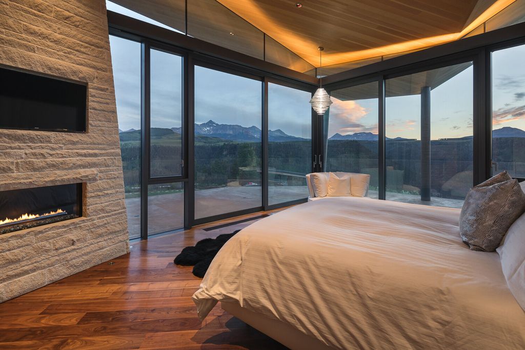 The Colorado Mansion is a modern architectural masterpiece is perched on a point featuring thrilling views of Telluride's most dramatic peaks now available for sale. This home located at 296 Gray Head Ln, Telluride, Colorado; offering 6 bedrooms and 10 bathrooms with over 11,800 square feet of living spaces.