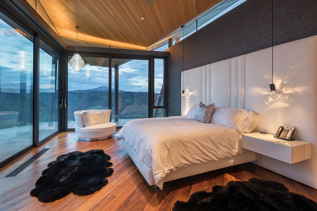 The Colorado Mansion is a modern architectural masterpiece is perched on a point featuring thrilling views of Telluride's most dramatic peaks now available for sale. This home located at 296 Gray Head Ln, Telluride, Colorado; offering 6 bedrooms and 10 bathrooms with over 11,800 square feet of living spaces.