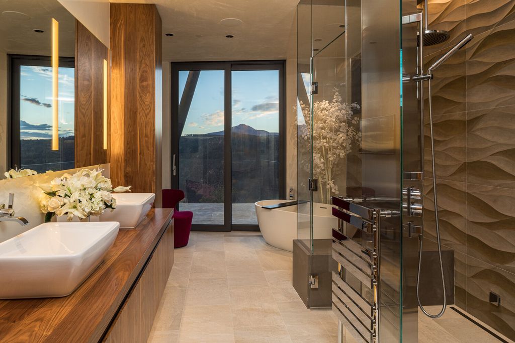 The Colorado Mansion is a modern architectural masterpiece is perched on a point featuring thrilling views of Telluride's most dramatic peaks now available for sale. This home located at 296 Gray Head Ln, Telluride, Colorado; offering 6 bedrooms and 10 bathrooms with over 11,800 square feet of living spaces.