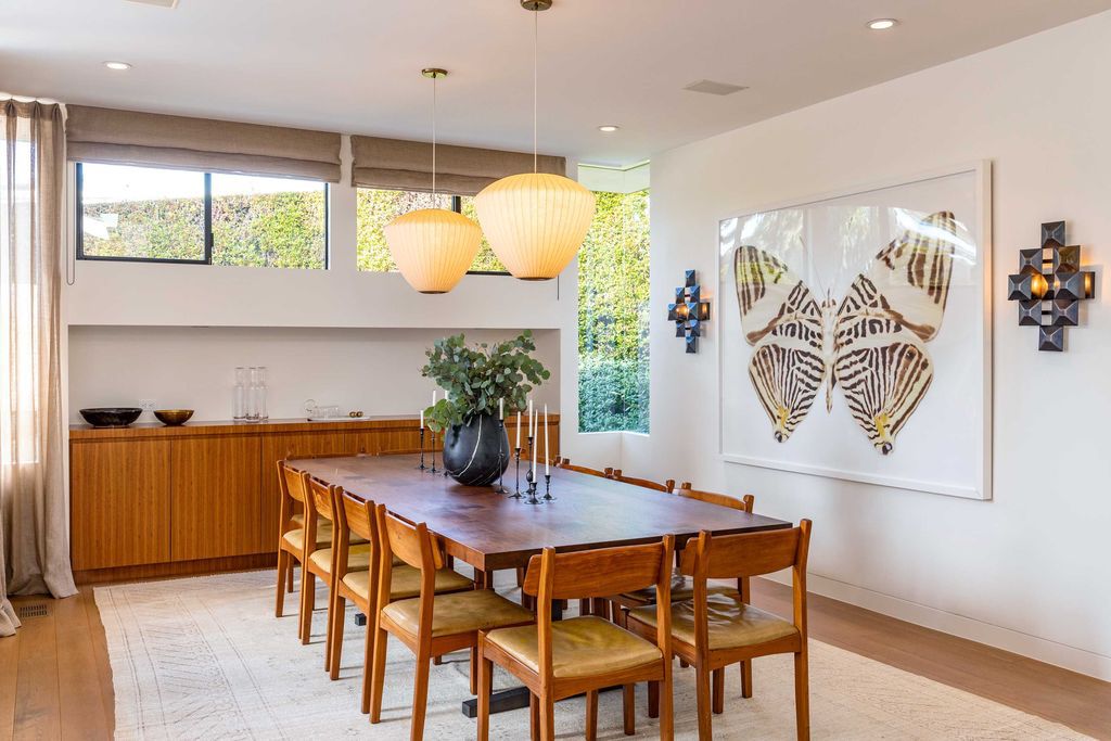 The Mid Century Home in Beverly Hills is a organic property offers total privacy, effortless indoor - outdoor living and unparalleled treetop views now available for sale. This home located at 1030 Woodland Dr, Beverly Hills, California; offering 4 bedrooms and 4 bathrooms with over 4,400 square feet of living spaces.