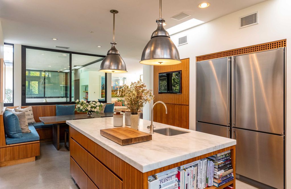 The Mid Century Home in Beverly Hills is a organic property offers total privacy, effortless indoor - outdoor living and unparalleled treetop views now available for sale. This home located at 1030 Woodland Dr, Beverly Hills, California; offering 4 bedrooms and 4 bathrooms with over 4,400 square feet of living spaces.