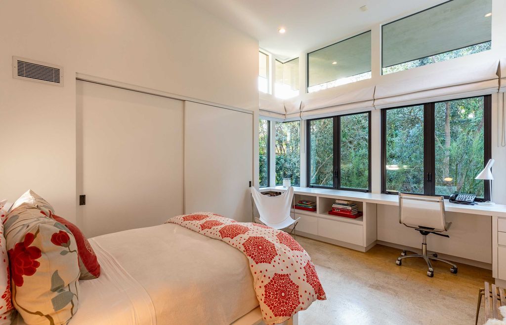 The Mid Century Home in Beverly Hills is a organic property offers total privacy, effortless indoor - outdoor living and unparalleled treetop views now available for sale. This home located at 1030 Woodland Dr, Beverly Hills, California; offering 4 bedrooms and 4 bathrooms with over 4,400 square feet of living spaces.