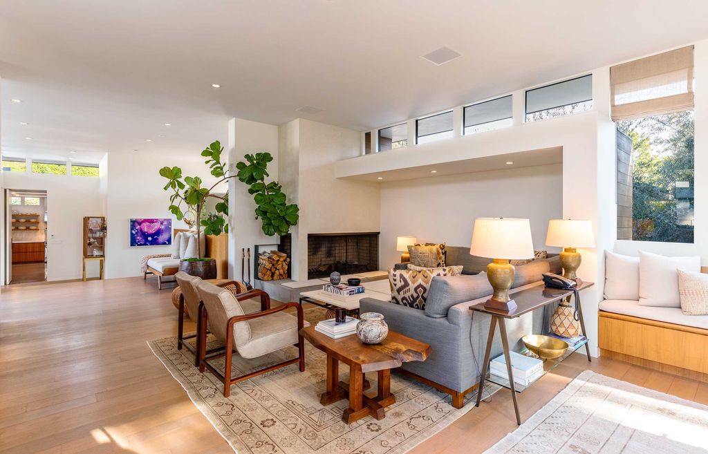 The Mid Century Home in Beverly Hills is a organic property offers total privacy, effortless indoor - outdoor living and unparalleled treetop views now available for sale. This home located at 1030 Woodland Dr, Beverly Hills, California; offering 4 bedrooms and 4 bathrooms with over 4,400 square feet of living spaces.