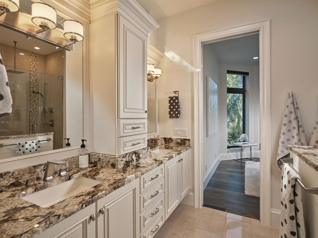 The Home on Marco Island is a Incredible island sanctuary nestled along the natural shoreline of Barfield Bay now available for sale. This home located at 899 Caxambas Dr, Marco Island, Florida; offering 5 bedrooms and 5 bathrooms with over 6,000 square feet of living spaces.