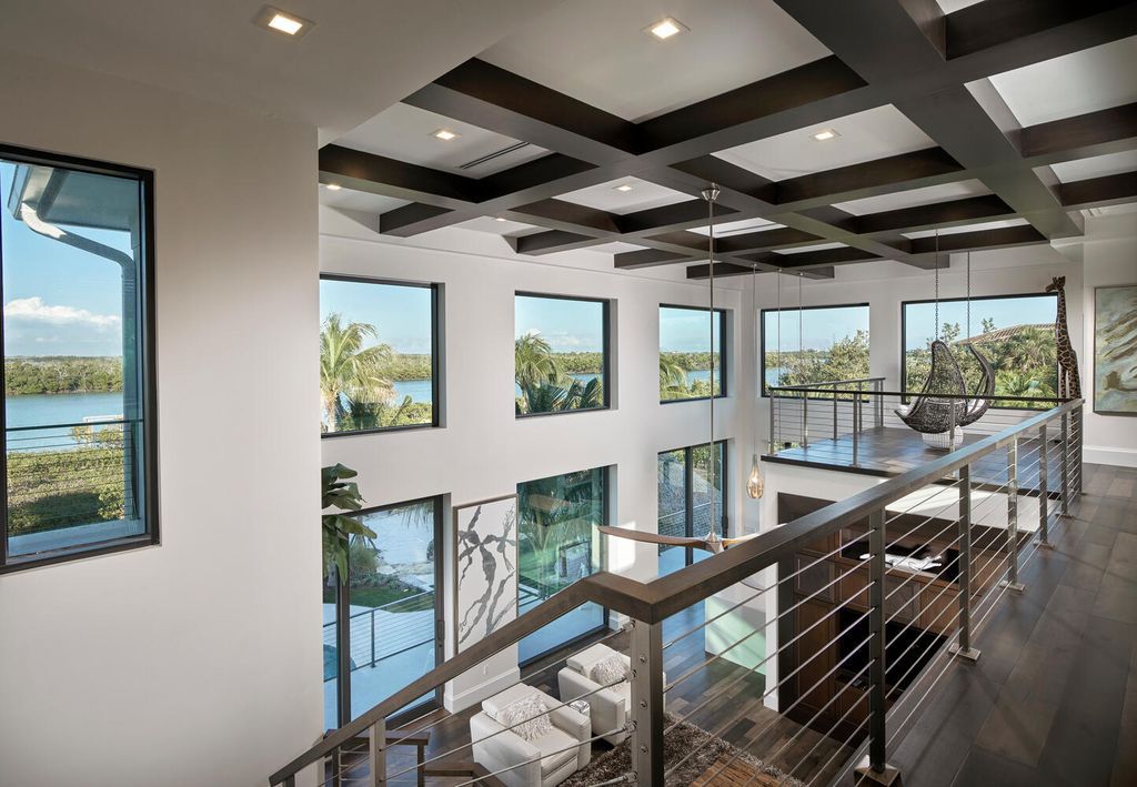 The Home on Marco Island is a Incredible island sanctuary nestled along the natural shoreline of Barfield Bay now available for sale. This home located at 899 Caxambas Dr, Marco Island, Florida; offering 5 bedrooms and 5 bathrooms with over 6,000 square feet of living spaces.