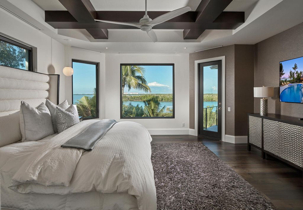 The Home on Marco Island is a Incredible island sanctuary nestled along the natural shoreline of Barfield Bay now available for sale. This home located at 899 Caxambas Dr, Marco Island, Florida; offering 5 bedrooms and 5 bathrooms with over 6,000 square feet of living spaces.