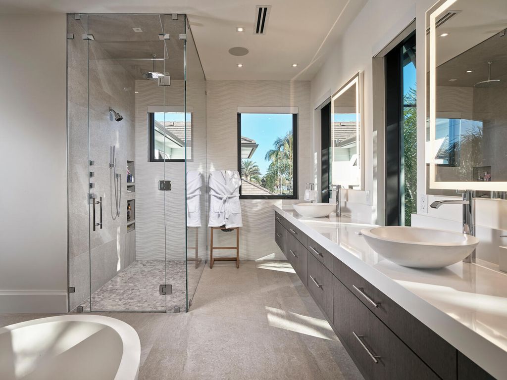 The Home on Marco Island is a Incredible island sanctuary nestled along the natural shoreline of Barfield Bay now available for sale. This home located at 899 Caxambas Dr, Marco Island, Florida; offering 5 bedrooms and 5 bathrooms with over 6,000 square feet of living spaces.
