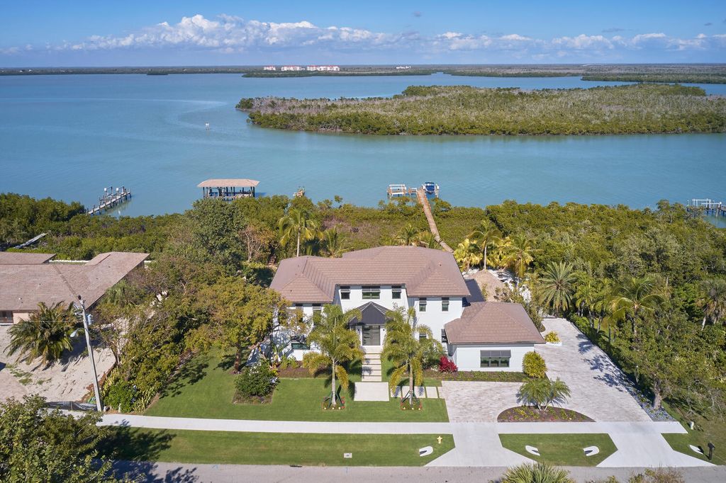 The Home on Marco Island is a Incredible island sanctuary nestled along the natural shoreline of Barfield Bay now available for sale. This home located at 899 Caxambas Dr, Marco Island, Florida; offering 5 bedrooms and 5 bathrooms with over 6,000 square feet of living spaces.