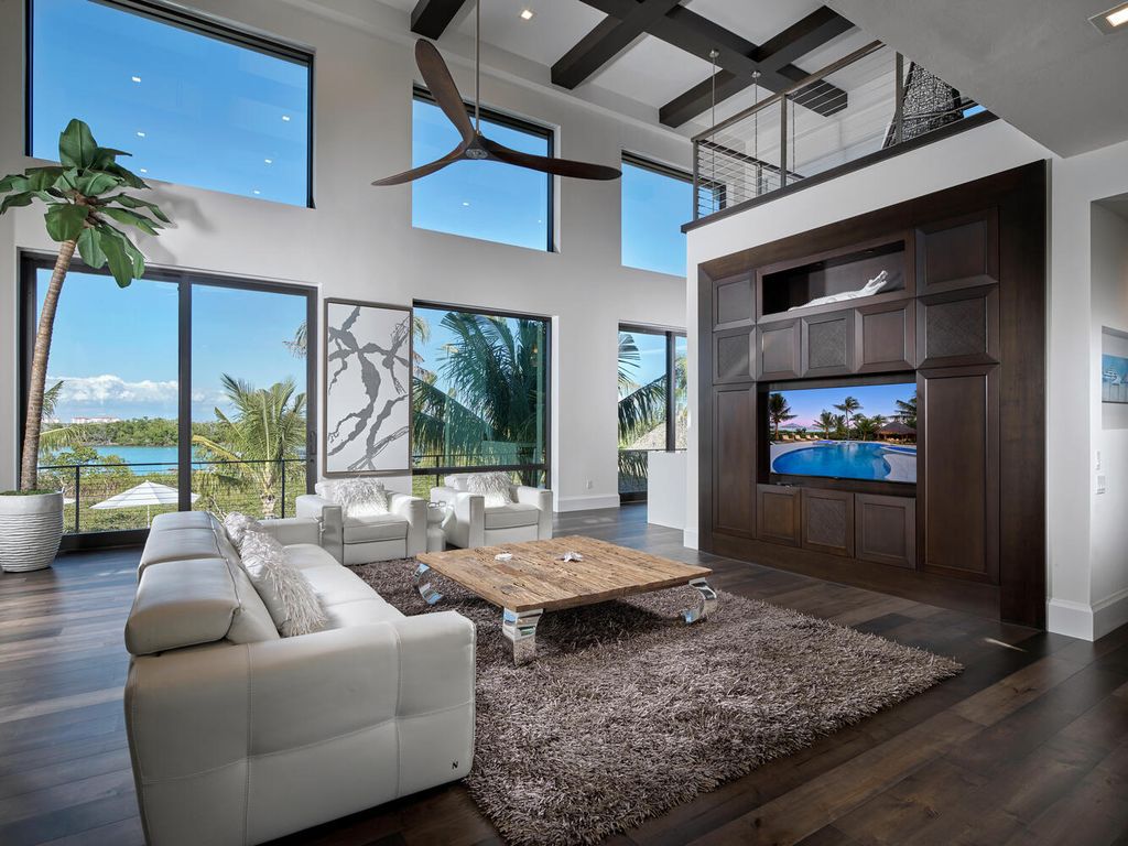 The Home on Marco Island is a Incredible island sanctuary nestled along the natural shoreline of Barfield Bay now available for sale. This home located at 899 Caxambas Dr, Marco Island, Florida; offering 5 bedrooms and 5 bathrooms with over 6,000 square feet of living spaces.