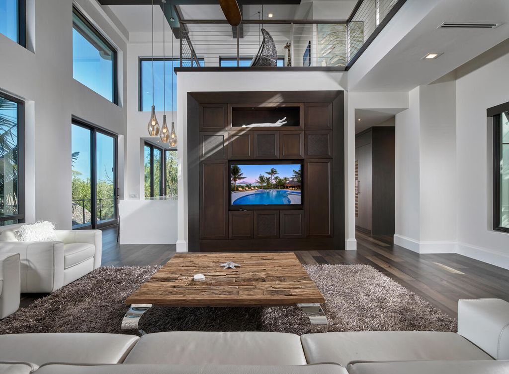 The Home on Marco Island is a Incredible island sanctuary nestled along the natural shoreline of Barfield Bay now available for sale. This home located at 899 Caxambas Dr, Marco Island, Florida; offering 5 bedrooms and 5 bathrooms with over 6,000 square feet of living spaces.