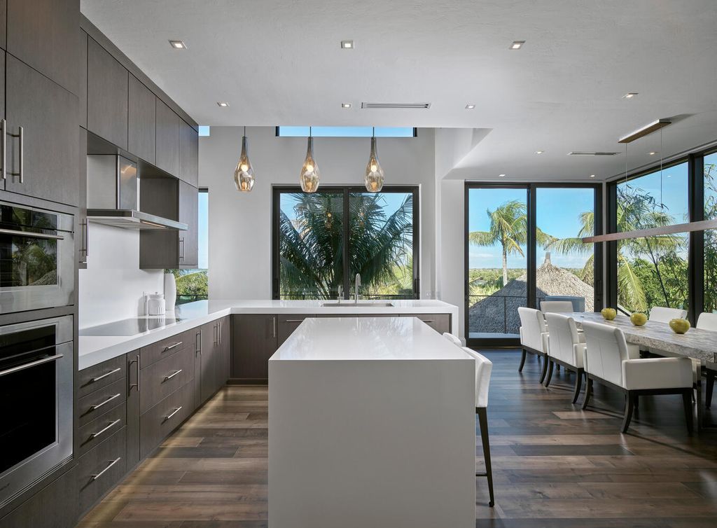The Home on Marco Island is a Incredible island sanctuary nestled along the natural shoreline of Barfield Bay now available for sale. This home located at 899 Caxambas Dr, Marco Island, Florida; offering 5 bedrooms and 5 bathrooms with over 6,000 square feet of living spaces.