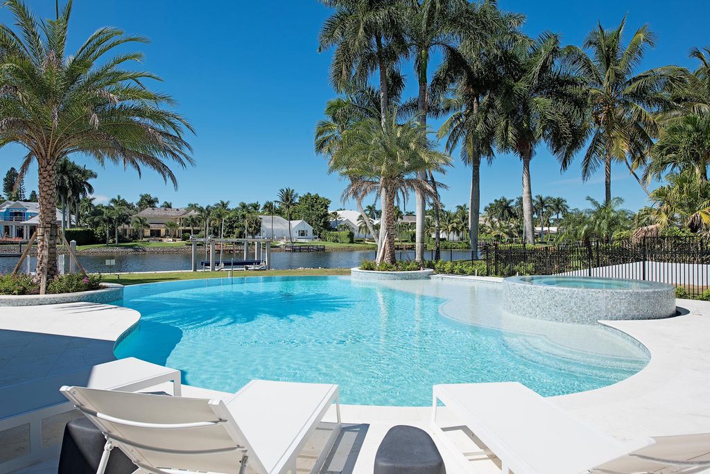 The Naples Home is a classical, lightly lived-in estate with extensive outdoor patios and landscaping finish off the tropical exterior now available for sale. This home located at 1200 Galleon Dr, Naples, Florida; offering 6 bedrooms and 12 bathrooms with over 7,700 square feet of living spaces