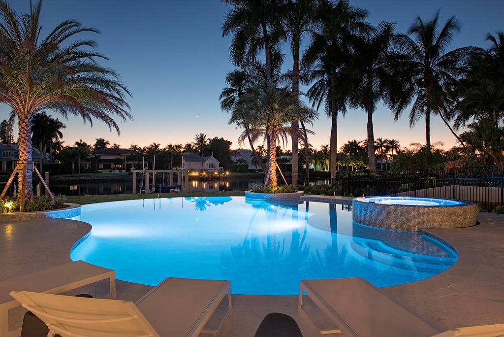 The Naples Home is a classical, lightly lived-in estate with extensive outdoor patios and landscaping finish off the tropical exterior now available for sale. This home located at 1200 Galleon Dr, Naples, Florida; offering 6 bedrooms and 12 bathrooms with over 7,700 square feet of living spaces