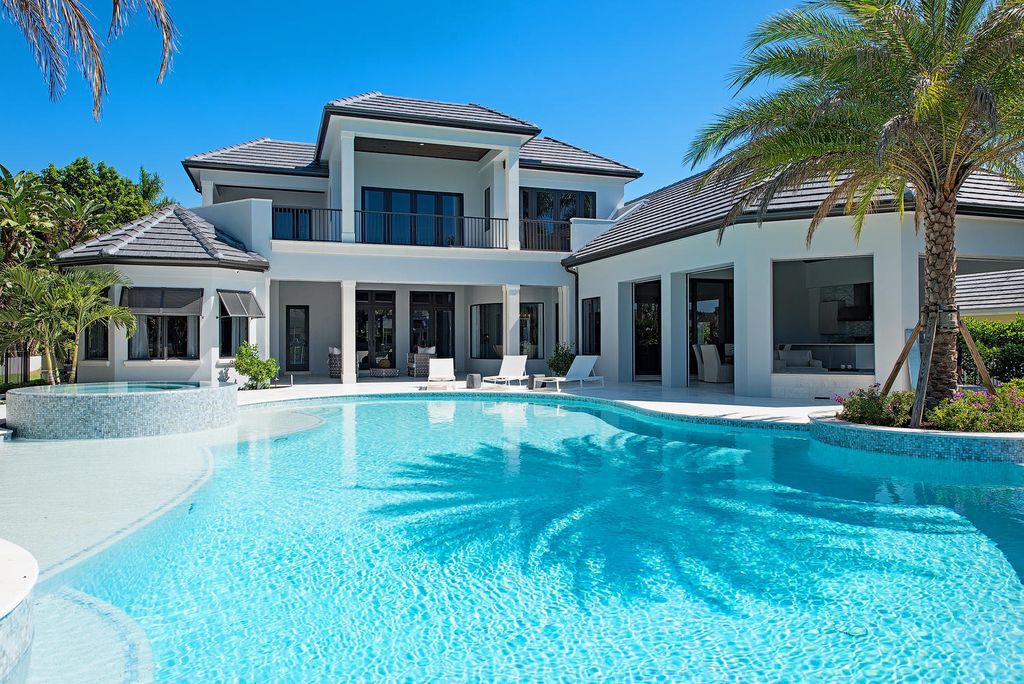The Naples Home is a classical, lightly lived-in estate with extensive outdoor patios and landscaping finish off the tropical exterior now available for sale. This home located at 1200 Galleon Dr, Naples, Florida; offering 6 bedrooms and 12 bathrooms with over 7,700 square feet of living spaces