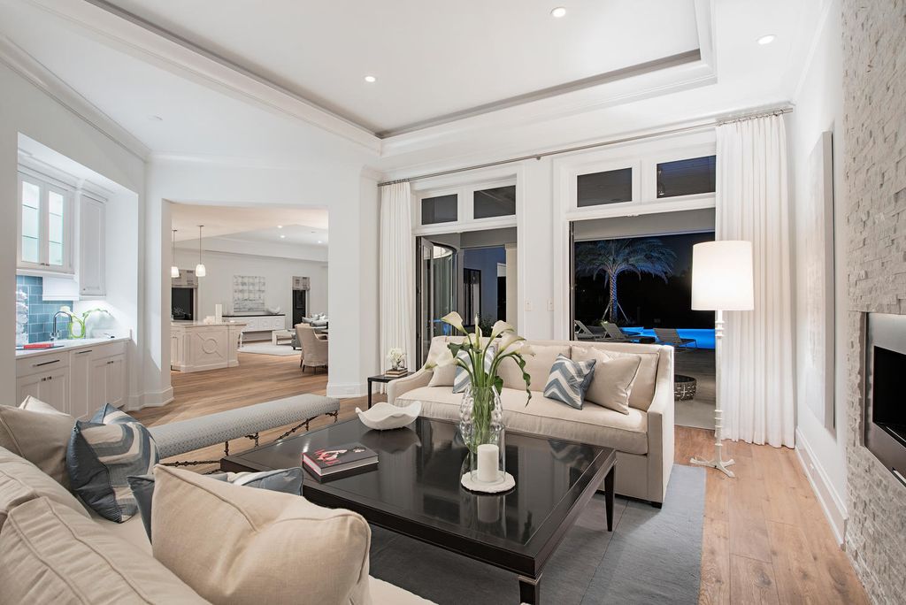 The Naples Home is a classical, lightly lived-in estate with extensive outdoor patios and landscaping finish off the tropical exterior now available for sale. This home located at 1200 Galleon Dr, Naples, Florida; offering 6 bedrooms and 12 bathrooms with over 7,700 square feet of living spaces