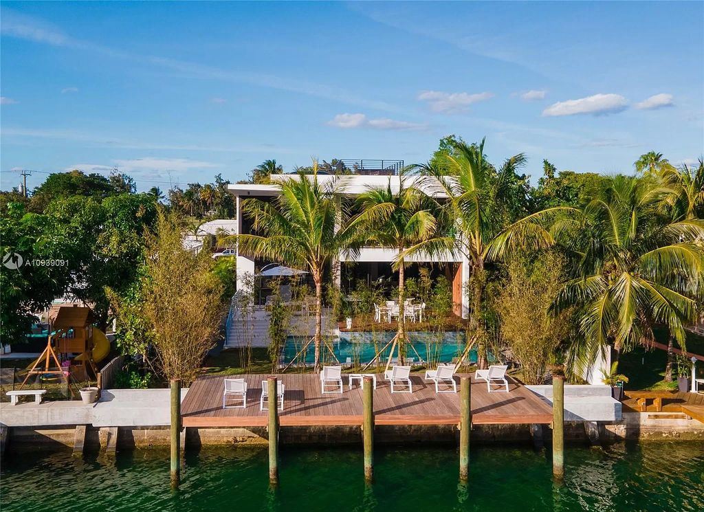 The Miami Beach Home is a new construction modern masterpiece located within the serene gated community of Normandy Isle now available for sale. This home located at 770 S Shore Dr, Miami Beach, Florida; offering 4 bedrooms and 5 bathrooms with over 5,000 square feet of living spaces.